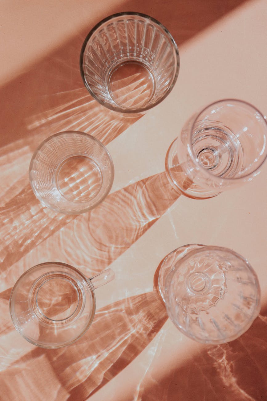 elegant glassware shadows on beige surface
